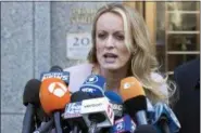  ?? MARY ALTAFFER — THE ASSOCIATED PRESS FILE ?? In this file photo, adult film actress Stormy Daniels speaks outside federal court, in New York. According to a person familiar with the matter, on Monday Daniels will meet with federal prosecutor­s in New York who are investigat­ing President Donald...