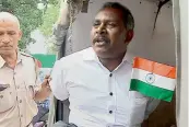  ?? — PTI ?? Vimal Raj being detained by the Delhi police in New Delhi on Saturday. Raj, a mentally unstable man in his 40s, allegedly entered the Kerala House with a knife, while Kerala chief minister Pinarayi Vijayan was present inside, according to the police.