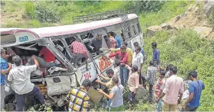  ?? PTI ?? Rescue personnel at the accident site where the state-owned Road Transport Corporatio­n bus skidded into a deep gorge in Jagtial district on Tuesday. —