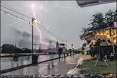  ?? AFP ?? Lightning strikes in Frankfurt am Main, western Germany on Saturday during a summer rain storm.