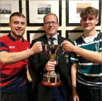  ??  ?? Pictured are Coláiste Chill Mhantáin captain Cormac Fenton and East Glendaloug­h captain Charlie Williams along with WRFC President Brian Clarke ahead of the inaugural Senior Schools Challenge Cup game that . The game takes place this Friday at Wicklow RFC from 7pm.