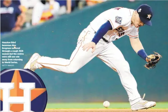  ?? GETTY IMAGES ?? Houston third baseman Alex Bregman suffered through a rough 2020 season but the Astros were still one win away from returning to World Series.