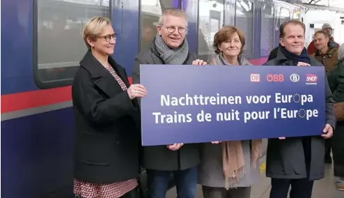 ?? ?? Caption: Minister Georges Gilkinet (second from the left) welcomes the arrival of the new night train coming from Berlin in the Brussels Midi station on 12 December 2023.