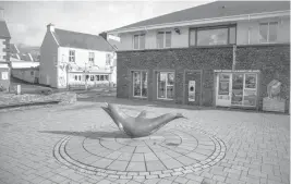  ??  ?? Asculpture of Fungie the dolphin in Dingle, Ireland.