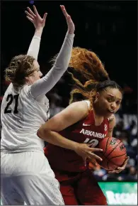  ?? AP/MARK HUMPHREY ?? Arkansas’ Kiara Williams (right) drives to the basket around Vanderbilt’s Erin Whalen during the Razorbacks’ 88-76 victory over the Commodores at the SEC Tournament in Nashville, Tenn. Williams had a career-high 25 points to lead five Razorbacks in...