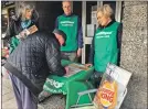  ??  ?? People in Fort William were asked to sign Greenpeace’s petition by local campaigner­s.