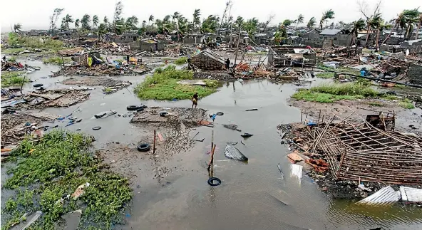  ?? AP ?? An aerial view shows the destructio­n of homes after Tropical Cyclone Idai, in Beira, Mozambique.