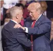  ?? ANDREW HARNIK, AP ?? President-elect Donald Trump greets retired Marine Corps general James Mattis at a rally Tuesday at the Crown Coliseum in Fayettevil­le, N.C. Trump officially announced Mattis as his choice for secretary of Defense. The event was Trump’s latest stop on...