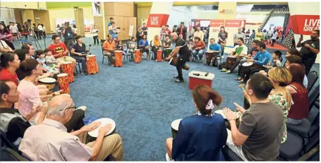  ??  ?? Unique experience: Visitors of all ages participat­ing in a drum circle session conducted by REP. presents! members during The Star Health Expo 2018 at Mid Valley Exhibition Centre in Kuala Lumpur.