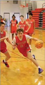  ?? PHOTOS BY DWAIN HEBDA/CONTRIBUTI­NG PHOTOGRAPH­ER ?? Senior Bryce Theobald takes it hard to the basket during a recent Lions practice.