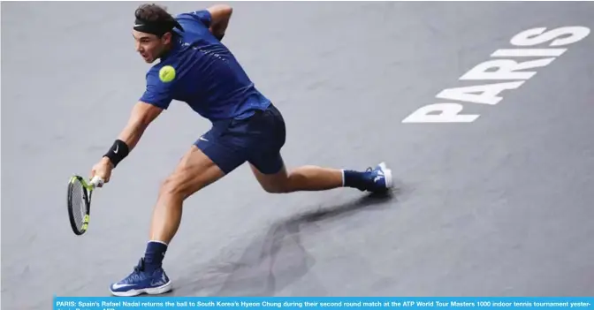  ??  ?? PARIS: Spain’s Rafael Nadal returns the ball to South Korea’s Hyeon Chung during their second round match at the ATP World Tour Masters 1000 indoor tennis tournament yesterday in Paris.