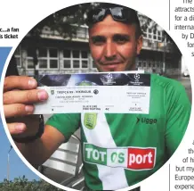  ??  ?? Historic...a fan with his ticket