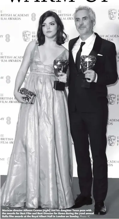  ?? Photo: IC ?? Mexican director Alfonso Cuaron (right) and his daughter Tessa pose with the awards for Best Film and Best Director for Roma during the 72nd annual Bafta film awards at the Royal Albert Hall in London on Sunday.