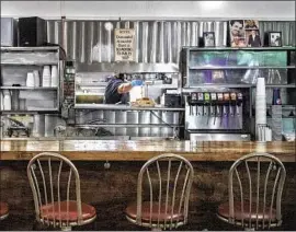  ?? Mariah Tauger Los Angeles Times ?? GIFT CARDS are an effective, and delicious, way to support local restaurant­s, Steve Lopez writes. Above, the counter at El Tepeyac Cafe in Boyle Heights.