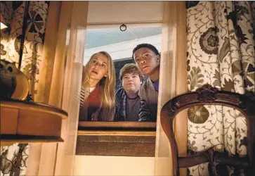  ?? Daniel McFadden Columbia Pictures ?? SARAH (Madison Iseman), Sonny (Jeremy Ray Taylor, center) and Sam (Caleel Harris) in Halloween film.