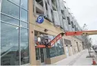  ?? MICHAEL SEARS / MILWAUKEE JOURNAL SENTINEL ?? Work continues at a brisk pace on the east side of the building.