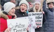  ?? WAYNE CUDDINGTON ?? Dozens of parents who have children with autism spectrum disorder picket MacLeod’s office last Friday over the provincial government’s sweeping reforms to the Ontario Autism Program.