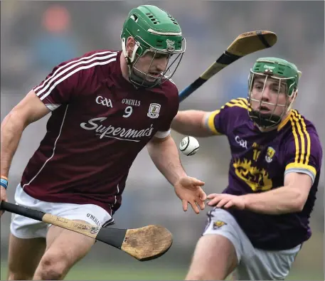  ??  ?? Aidan Nolan pursues David Burke of Galway when the counties last met in the National League in Salthill in February. If the new round robin proposals are passed, there’s a strong chance Wexford will be travelling west to play championsh­ip hurling in...