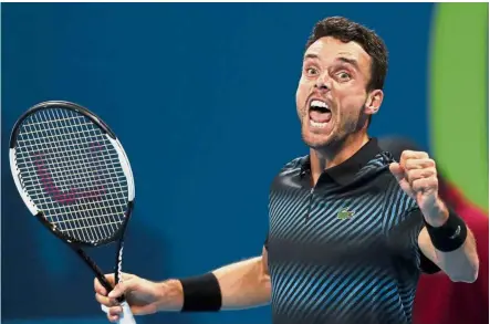  ?? — AFP ?? Sheer joy: Roberto Bautista Agut of Spain reacts after defeating Novak Djokovic of Serbia in their ATP Qatar Open semi-final match in Doha on Friday.