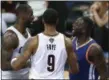  ?? RON SCHWANE — ASSOCIATED PRESS ?? Warriors forward Draymond Green, right, and LeBron James argue while being separated by Channing Frye during Game 4 of the Finals.