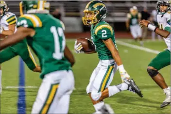  ?? Cory Rubin/The Signal (See additional photos at signalscv.com) ?? Canyon’s James Mendibles carries the ball in a game against Royal at Canyon on Friday. Canyon won 48-21.