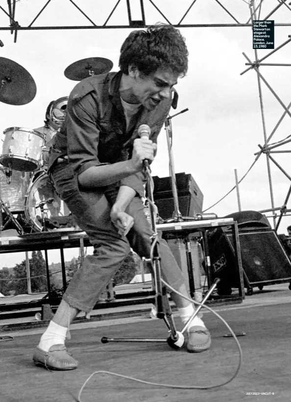  ?? ?? Larger than life: Mark Stewart on stage at Alexandra Palace, London, June 15, 1980