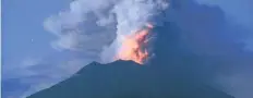  ?? SONNY TUMBELAKA/GETTY IMAGES ?? Authoritie­s have told 100,000 people living near Bali’s Mount Agung to leave the area as the volcano continues to erupt.