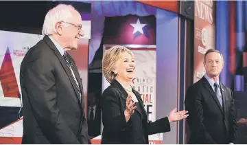  ??  ?? (From left-right) Sanders, Clinton and O’Malley stand on the stage prior to a presidenti­al debate sponsored by CBS at Drake University in Des Moines, Iowa. — AFP photo