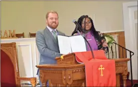  ?? / Sean Williams ?? Top: The annual Cedartown Commission-approved Martin Luther King Jr. proclamati­on was presented with the help of youth during the YWTSA’s annual event on Sunday. Above: Cedartown Commission Chair Matt Foster presented the YWTSA with a proclamati­on passed by the city honoring Martin Luther King Jr.