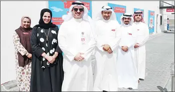  ??  ?? Ooredoo officials pose for a group photo.