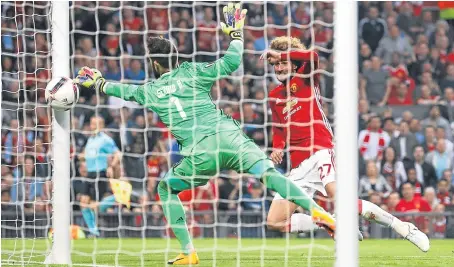  ?? Picture: PA. ?? Marouane Fellaini’s header beats Celta keeper Sergio Alvarez to give United the lead last night.