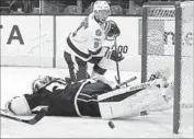  ??  ?? GOALIE Peter Budaj of the Kings sprawls on the ice after Tyler Johnson scores in the first period.