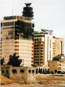  ?? —KUNA ?? KUWAIT: This file photo shows destructio­n at Kuwait Airway’s head office building in Kuwait City during the 1990/91 Iraqi Invasion.