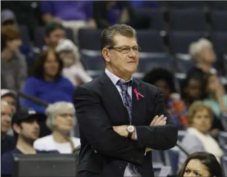  ?? KAREN PULFER FOCHT — THE ASSOCIATED PRESS ?? UConn coach Geno Auriemma watches his team during a lackluster first half of an eventual 80-34win over Memphis on Saturday in Memphis, Tenn.