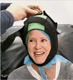  ??  ?? Smith credits the Dignicap scalp cooling system for saving her hair during her chemothera­py treatments