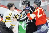  ?? Lynne Sladky The Associated Press ?? Linesman Scott Cherrey tries to break up a fight between Bruins center Trent Frederic and Panthers left wing Eetu Luostarine­n late in Florida’s 6-1 win.