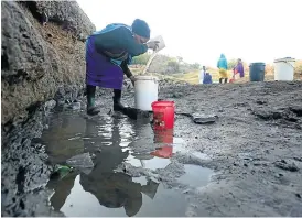  ??  ?? DAILY STRUGGLE: One of the challenges facing the Msinga community is a lack of water. People from Majozi village go to a water hole called Mbobokelo to fetch water