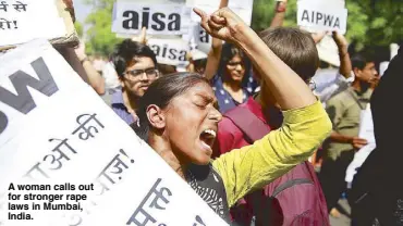  ??  ?? A woman calls out for stronger rape laws in Mumbai, India.