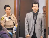  ?? Michael Blackshire Las Vegas Review-journal ?? Jaiden Caruso walks back for the verdict Wednesday in his murder trial at the Regional Justice Center. He and Kody Harlan were convicted of killing 17-year-old Matthew Minkler.