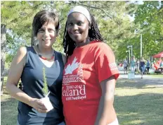  ?? MICHELLE ALLENBERG/WELLAND TRIBUNE ?? Betty Boyd, left, from Faith Welland Church, and Janet Madume from Welland’s Canada 150 Committee celebrate the grand opening of the 150 Trail on Merritt Island Saturday.