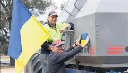  ?? Picture: PAUL CARRACHER ?? SUPPORT: Rupanyup’s Andrew, top, and Rod Weidemann fly a Ukrainian flag in support of farmers under attack. Wimmera farmers can donate to a national Grain Producers Australia-led initiative supporting affected farmers in conflict.
