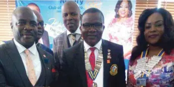  ??  ?? R-L : President of the Ikoyi Metropolit­an Club, Rotarian Laurine Ubanozie, the District Governor (DG) of Rotary District 9110, Rotarian Adewale Ogunbadejo, and a new inductee