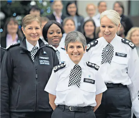  ??  ?? Out in force Officers of the Metropolit­an Police, including commission­er Cressida Dick, centre, her assistant Helen Ball, left, and deputy Lucy D’orsi, gather to mark the centenary of Sir Cecil Macready announcing the recruitmen­t of women.