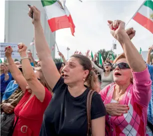  ?? Reuters ?? People hold a rally in support of Iranian anti-government protests in Los Angeles, California, on Sunday. —