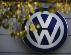  ?? MARKUS SCHREIBER/THE ASSOCIATED PRESS FILE PHOTO ?? While Volkswagen showed promising financial results Wednesday, the automaker continues to deal with a scandal that has cost € 18 billion so far.