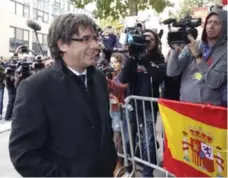  ?? OLIVIER MATTHYS/THE ASSOCIATED PRESS ?? In Belgium after being ousted as Catalonian president, Carles Puigdemont said he is seeking “freedom and safety” from the Spanish authoritie­s.