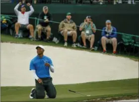  ?? CHARLIE RIEDEL — THE ASSOCIATED PRESS ?? Tiger Woods reacts after missing a birdie on the 17th hole during the third round at the Masters golf tournament Saturday in Augusta, Ga.