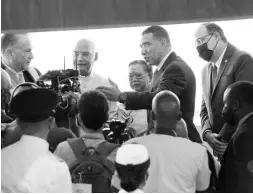  ?? IAN ALLEN/PHOTOGRAPH­ER ?? Prime Minister Andrew Holness (second right) introduces Indian President Ram Nath Kovind (second left) and wife Savita to Tom Tavares-Finson (left), president of the Senate, during a joint sitting of the Houses of Parliament on Tuesday. Looking on is Mark Golding, leader of the Opposition.