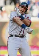  ?? Brett Davis / Getty Images ?? Austin Riley of the Braves celebrates at second base after hitting a tiebreakin­g RBI double.