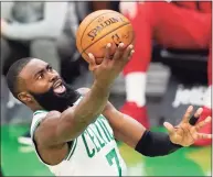  ?? Elise Amendola / Associated Press ?? The Celtics’ Jaylen Brown goes to the hoop against the Wizards on Friday in Boston.